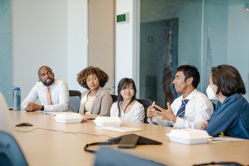 Image of Youth advocates sitting around table in Sacramento talking to policymakers