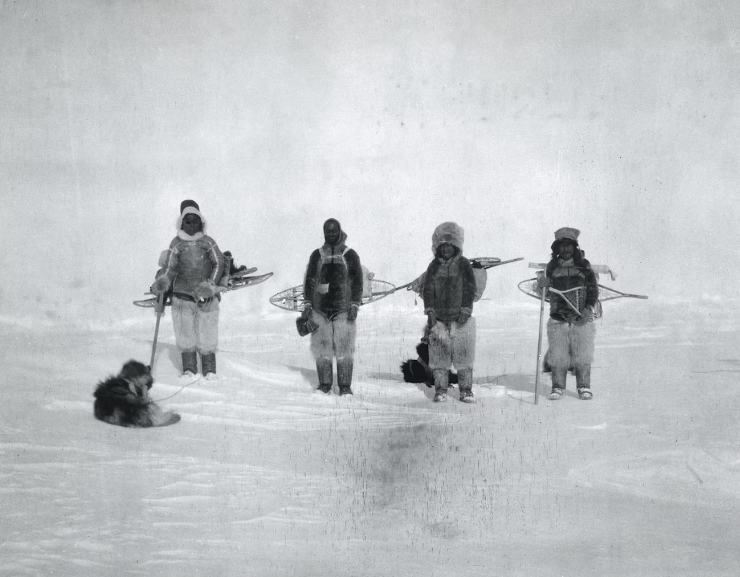 Henson poses with three Inuit team members and a sled dog during an overland crossing of the Arctic. PHOTOGRAPH BY ROBERT E. PEARY, NATIONAL GEOGRAPHIC